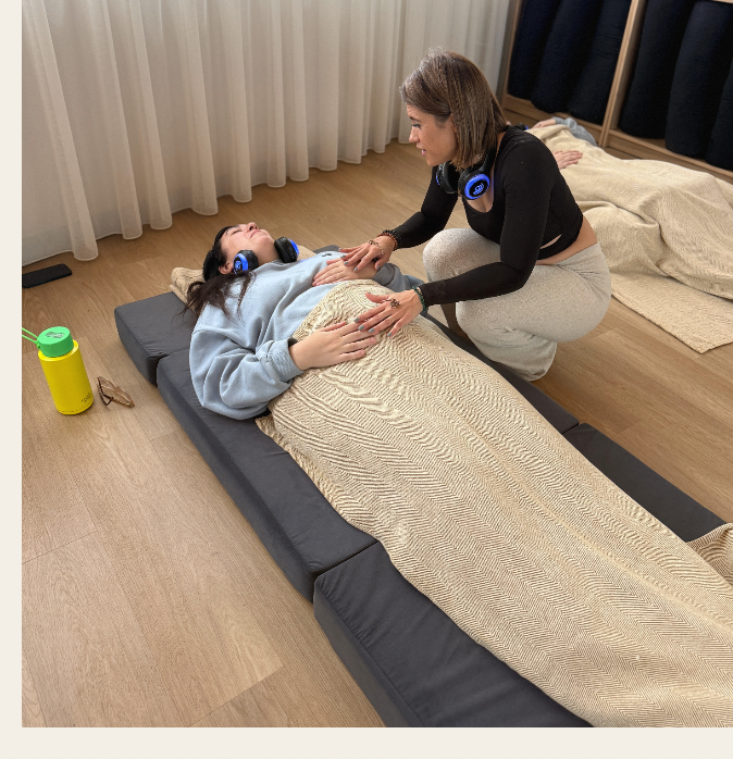 Roz guiding a participant through 9D breathwork